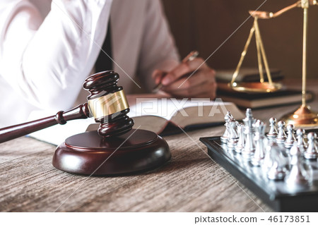 Male lawyer or judge working with Law books, gavel and balance, 46173851