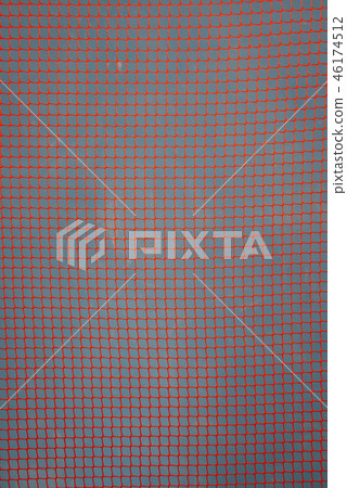 orange garden plastic fence mesh isolated on blue  46174512