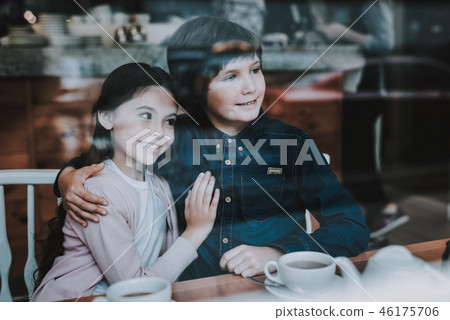 Brother and Sister is Resting in Cafe 46175706