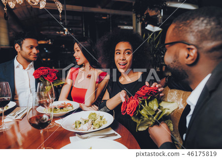 Friends in a Restaurant Enjoying Romantic Evening 46175819