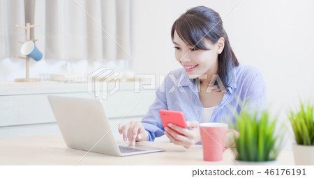 woman use computer and phone woman use computer and phone 46176191