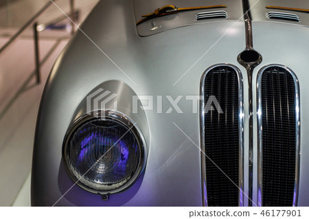 Old gray metallic car close up of headlight Old gray metallic car close up of headlight 46177901