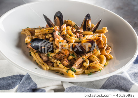 Italian pasta with mussels and prawn in plate. Italian pasta with mussels and prawn in plate. 46180982