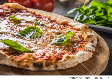 Italian traditional pizza margarita on round board Italian traditional pizza margarita on round board 46181003