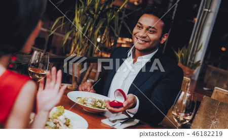 Hispanic Handsome Man Proposing to Girlfriend Hispanic Handsome Man Proposing to Girlfriend 46182219
