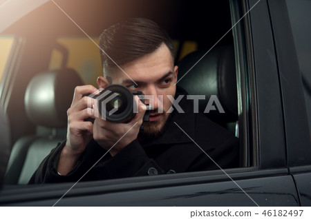 Close-up - Young Man Photorapher Sitting In The Car Close-up - Young Man Photorapher Sitting In The Car 46182497