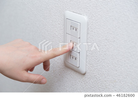 Hand pressing a power switch Hand pressing a power switch 46182600