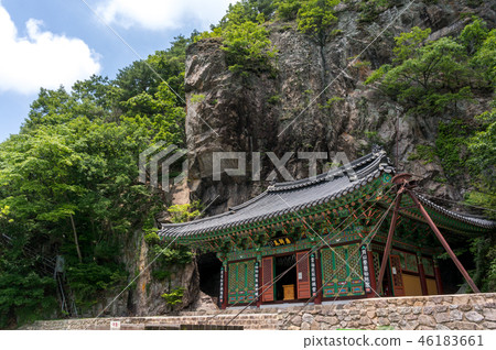Korean traditional temple under a cliff. 46183661