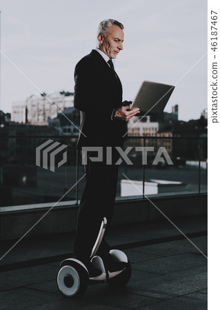 Man is Using a Laptop on Gyroboard 46187467