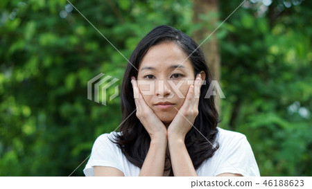 South East Asian girl looking green background South East Asian girl looking green background 46188623