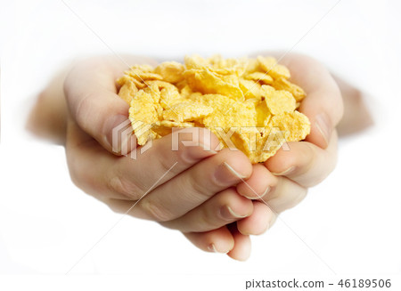 Cornflakes handful isolated. 46189506
