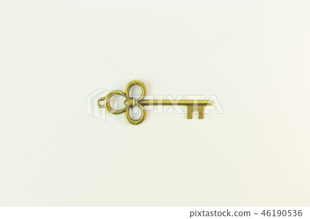 The vintage gold key on white background. The vintage gold key on white background. 46190536
