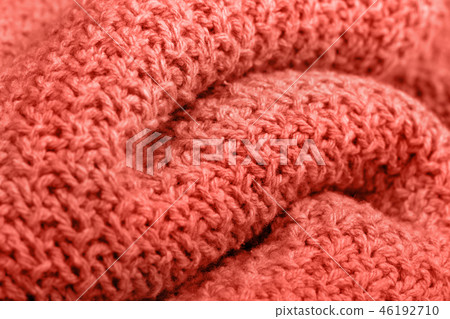 Knitted fabric texture living coral color. 46192710