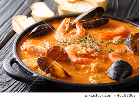 The rich taste of seafood Suquet de Peix soup 46192862