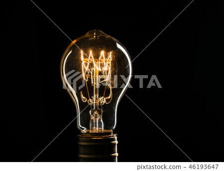 Edison's light bulb illuminates from electric current 46193647