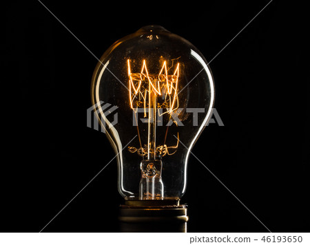 Edison's light bulb illuminates from electric current 46193650