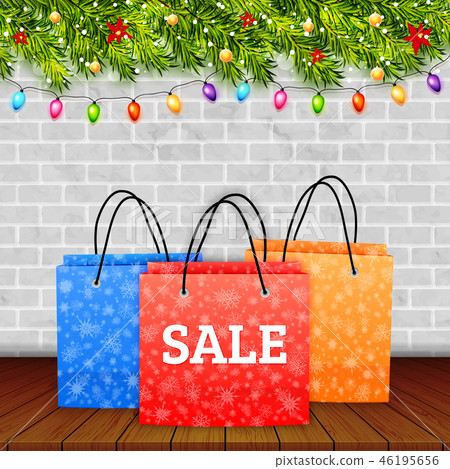 Christmas sale. Shoping paper bag on wood table 46195656