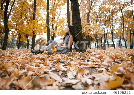 Pretty woman is in autumn park 46196231