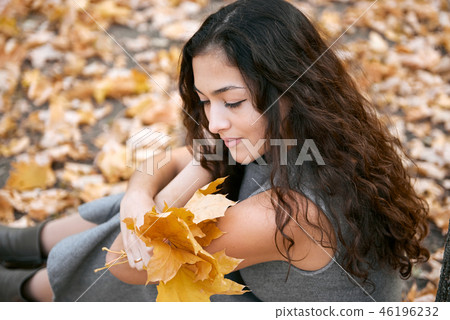 Pretty woman is in autumn park 46196232