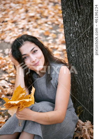 Pretty woman is in autumn park 46196234