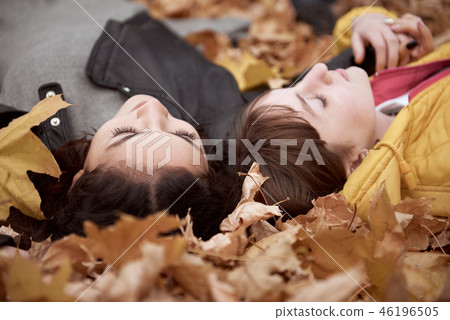 Pretty woman and teen girl are in autumn park 46196505
