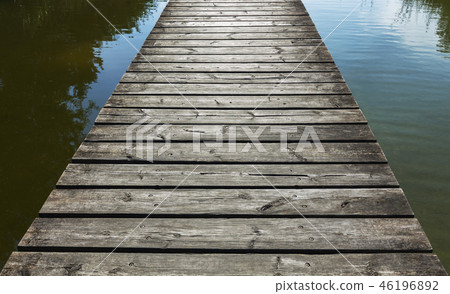 Jetty of the old board on the water surface Jetty of the old board on the water surface 46196892