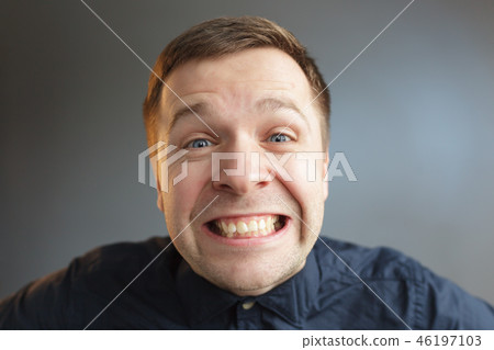 man in tin foil hat fearfully pulls palms forward man in tin foil hat fearfully pulls palms forward 46197103