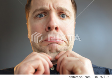 man in tin foil hat fearfully pulls palms forward man in tin foil hat fearfully pulls palms forward 46197106