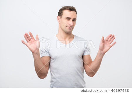 italian man in pink shirt is unsure 46197488