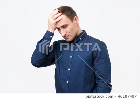 Young man in blue shirt is sad  46197497