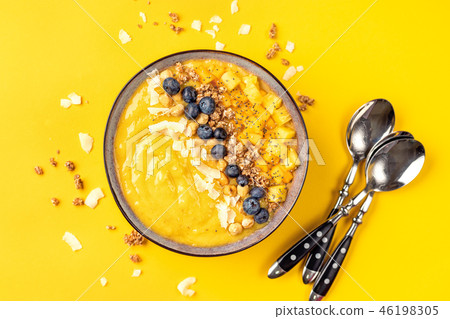 Top view of mango smoothie bowl with fruits 46198305