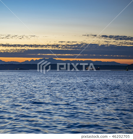Boats in Tacoma bay with a dramatic sky at sunset 46202705