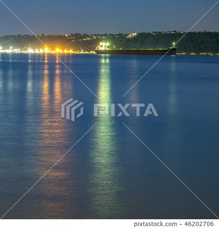 Boat lights reflected on ocean in Tacoma at sunset 46202706