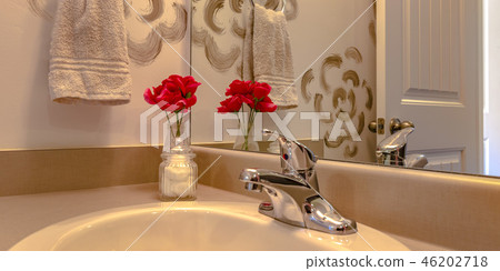 Bathroom with sink and faucet infront of a mirror Bathroom with sink and faucet infront of a mirror 46202718