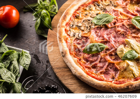 Pizza Quatro Stagioni traditional italian meal. Pizza Quatro Stagioni traditional italian meal. 46207609
