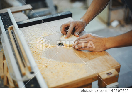 The carpenter works with a tree The carpenter works with a tree 46207735
