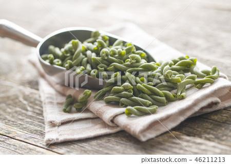 Uncooked spinach gemelli pasta. 46211213