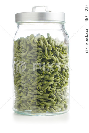 Uncooked spinach gemelli pasta. 46211232