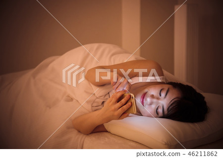 Woman sleep smart phone bedtime young woman cute lifestyle Woman sleep smart phone bedtime young woman cute lifestyle 46211862