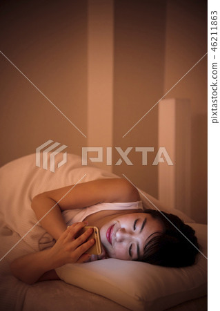 Woman sleep smart phone bedtime young woman cute lifestyle Woman sleep smart phone bedtime young woman cute lifestyle 46211863