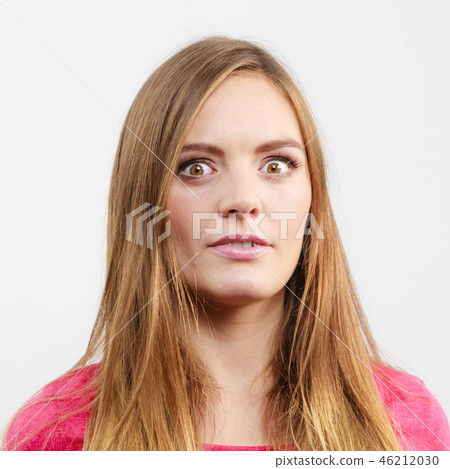 Woman looking shocked Woman looking shocked 46212030