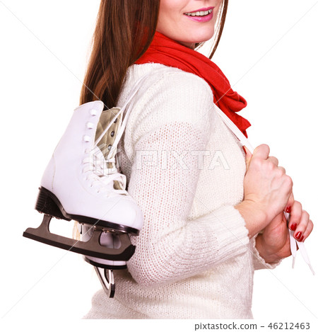 Smiling woman with ice skates 46212463
