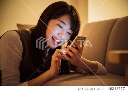 Woman smartphone night late night young woman cute 46212557