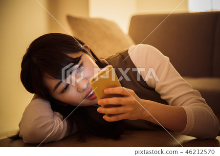 Woman smartphone night late night young woman cute Woman smartphone night late night young woman cute 46212570