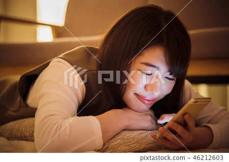 Woman smartphone night late night young woman cute Woman smartphone night late night young woman cute 46212603
