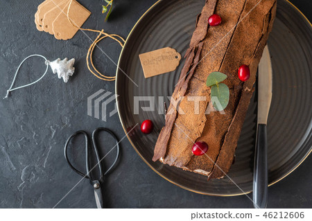 Buche de Noel. Traditional Christmas dessert, Christmas yule log cake with chocolate cream Buche de Noel. Traditional Christmas dessert, Christmas yule log cake with chocolate cream 46212606