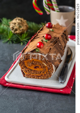 Buche de Noel. Traditional Christmas dessert, Christmas yule log cake with chocolate cream Buche de Noel. Traditional Christmas dessert, Christmas yule log cake with chocolate cream 46212629