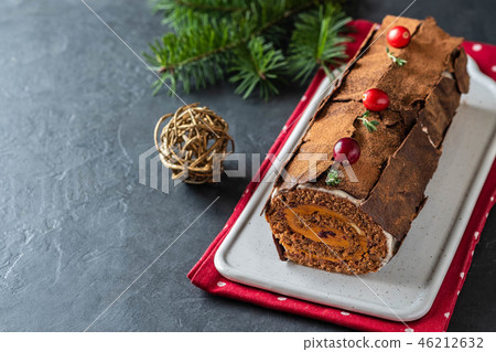 Buche de Noel. Traditional Christmas dessert, Christmas yule log cake with chocolate cream Buche de Noel. Traditional Christmas dessert, Christmas yule log cake with chocolate cream 46212632