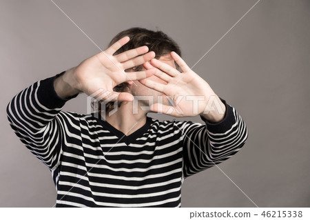 I give up. Attractive unshaven stylish man shows palms, demonstrates his innocence, surrenders 46215338