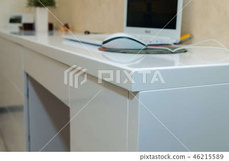 modern white furniture with drawers without handles in the home interior. 46215589